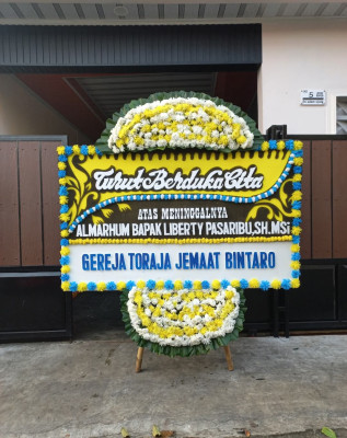Papan Bunga Duka di Trimurti